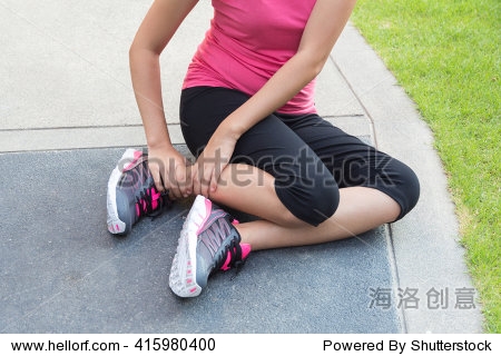 sporty woman get hurt with twisted ankle.