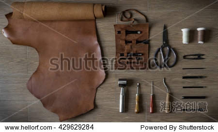 flat lay of leather craft crafting tools in retro style