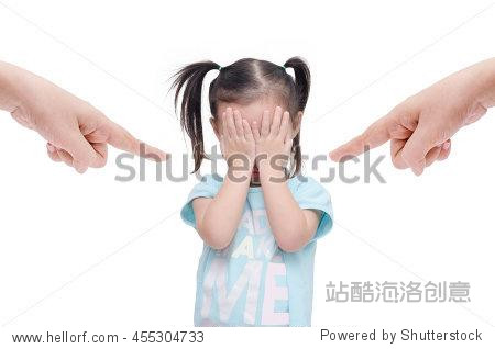 little asian girl crying while parents scold her