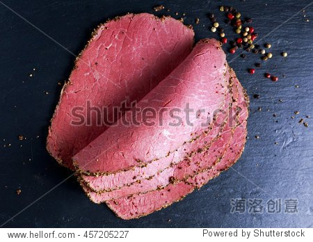 peppered roast beef pastrami slices on paper with