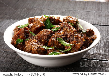 bowl of roasted mutton curry selective focus photograph.