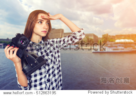 portrait of a pretty woman traveler in plaid shirt holding an