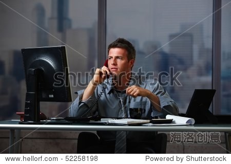 tired businessman on call working late holding glasses looking