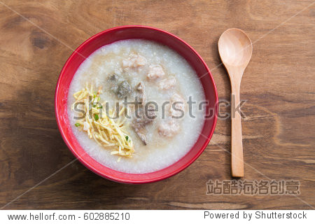 congee rice porridge rice gruel rice soup on wooden background