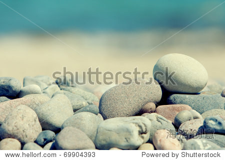 pile of stones isolated on a blur sea background
