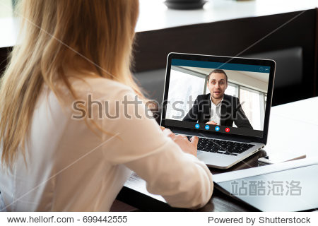 businesswoman making video call to business partner using laptop