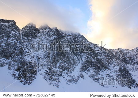 snow-capped mountain ridge in a clear evening in late autumn