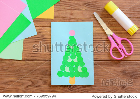 christmas greeting card colored paper scissors glue stick on a