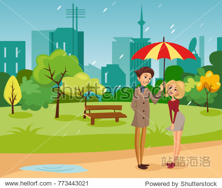 happy couple under one big striped umbrella walking in the park