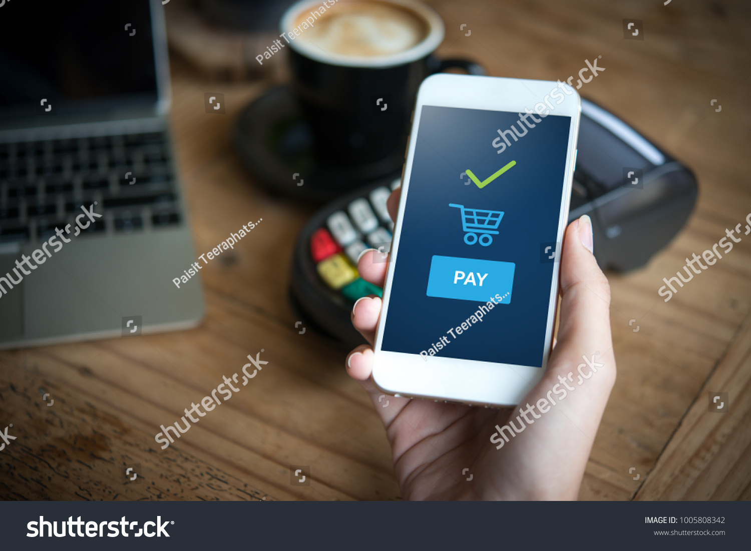 Hand and mobile payment in coffee shop  online shopping concept