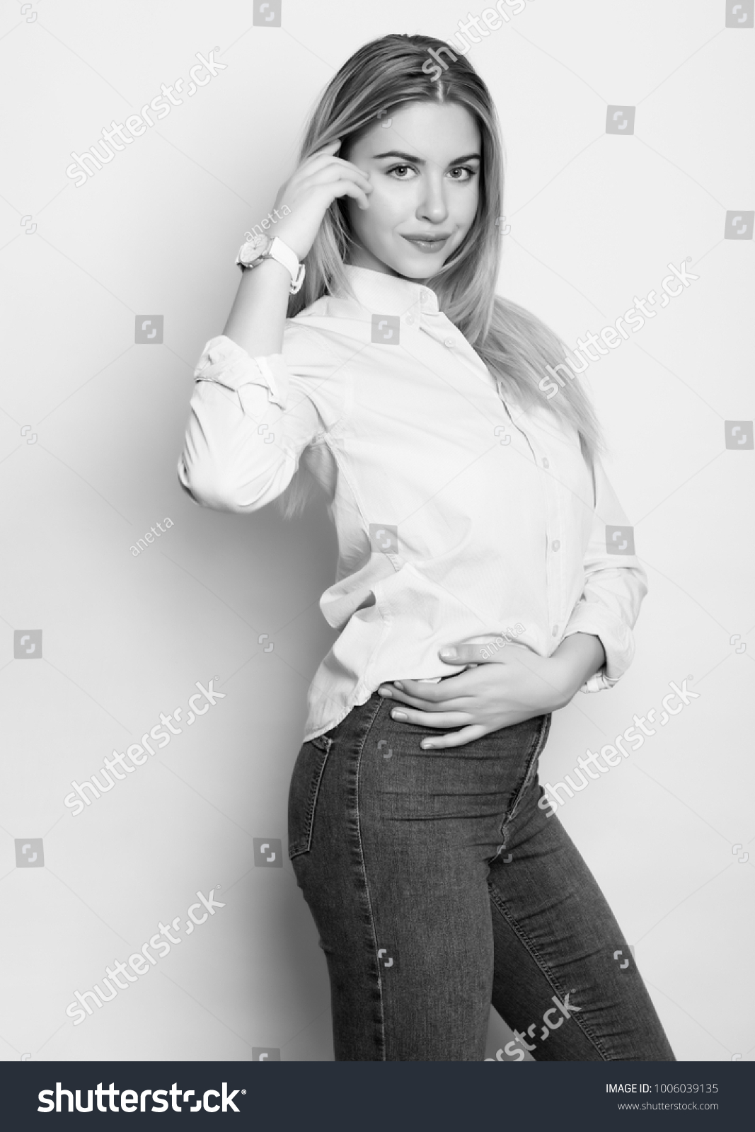 beautiful young woman with long hair wearing wrist watch