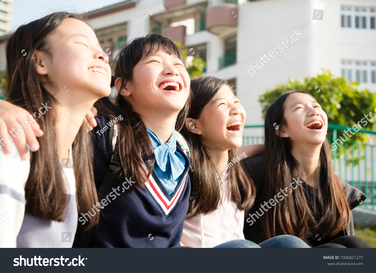 Group Of Teenage Students having fun