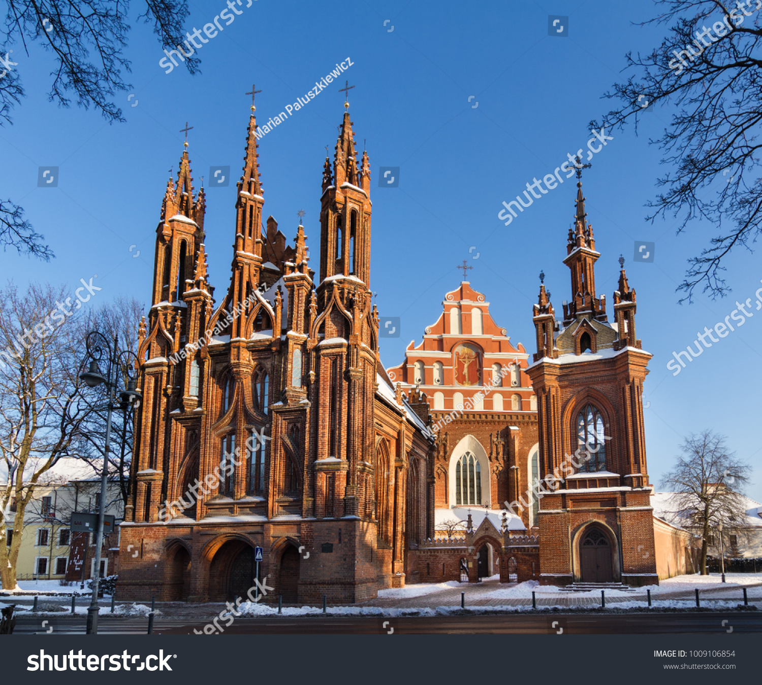 Front view of the red brick gothic St. Anne's church and Bernardine church in the Old Town of Vilnius  Lithuania on a winter day.