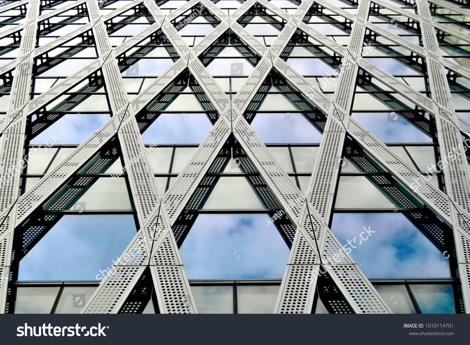 Futuristic glass and steel facade of an office building in downtown Singapore
