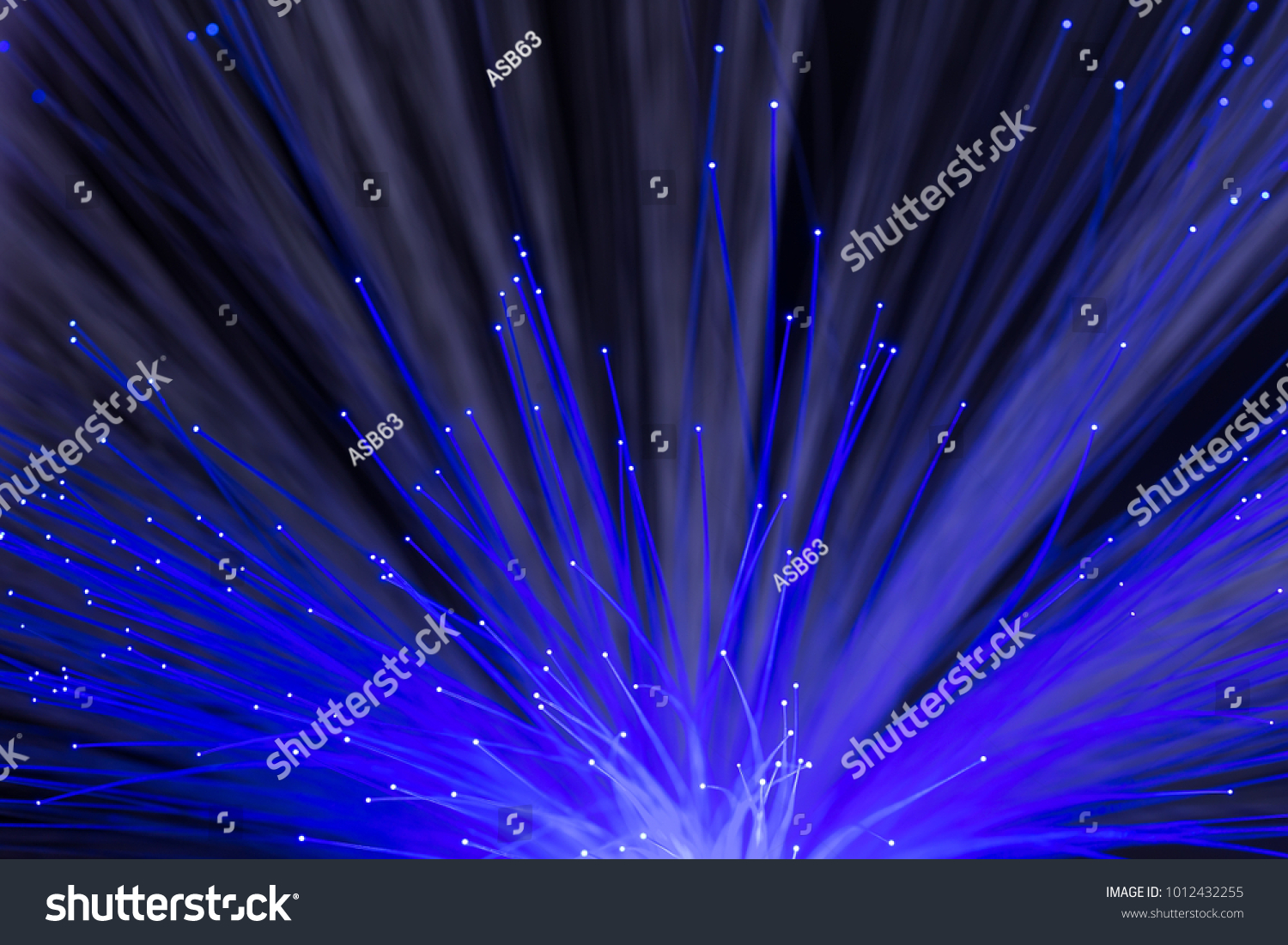 Abstract background of glowing blue color optical fibers