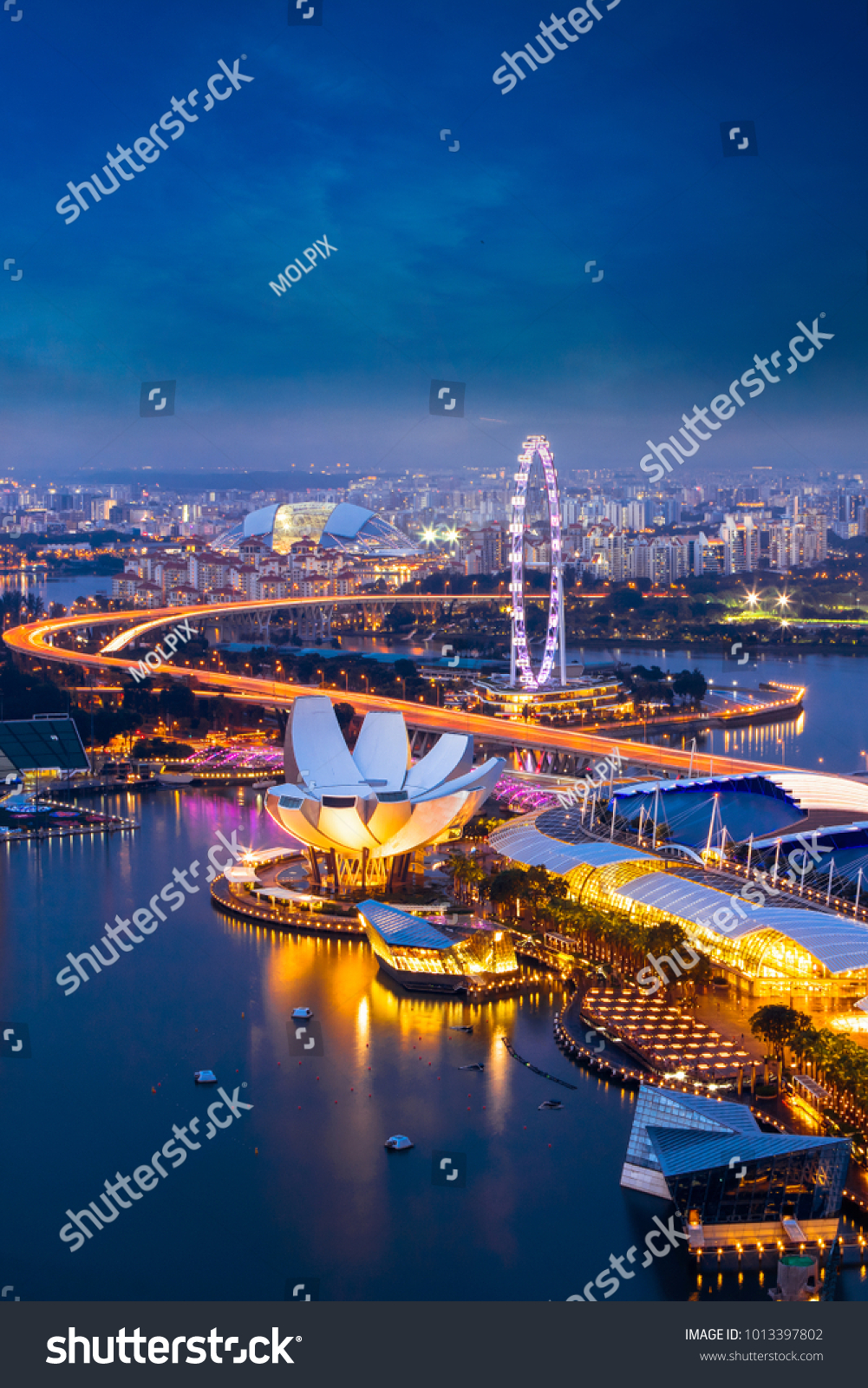Singapore cityscape at dusk. Landscape of Singapore business building around Marina bay. Aerial view of modern high building in business district area at twilight.