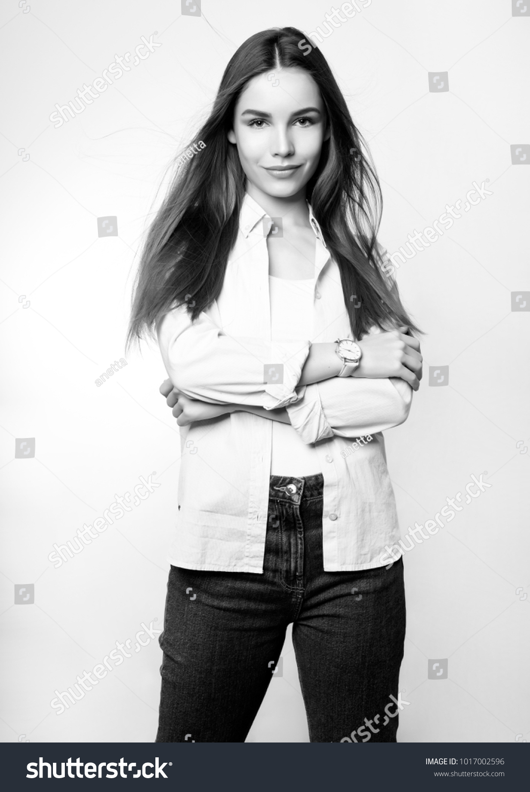 beautiful young woman with long hair wearing wrist watch