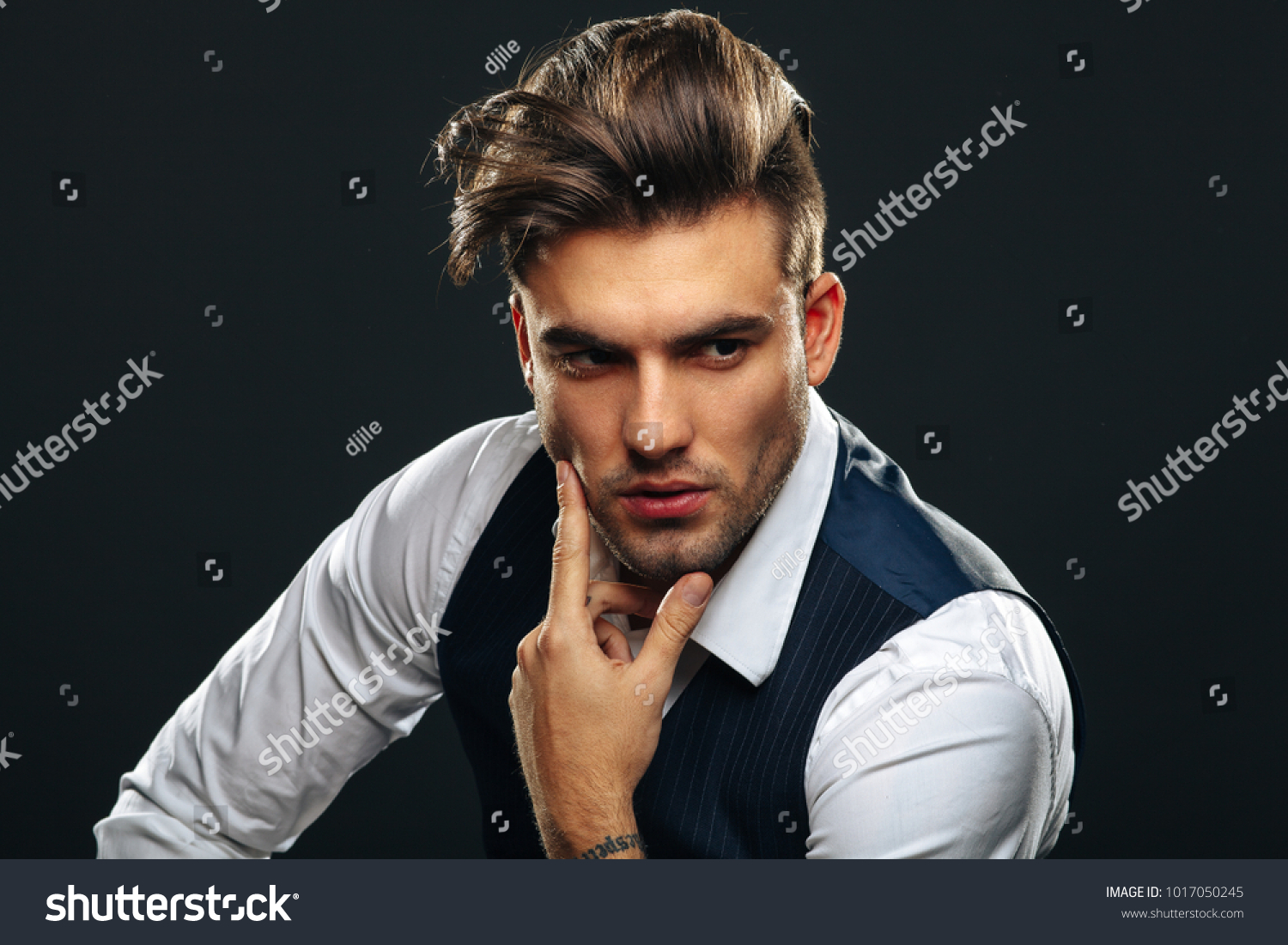 Portrait od handsome man in studio on dark background