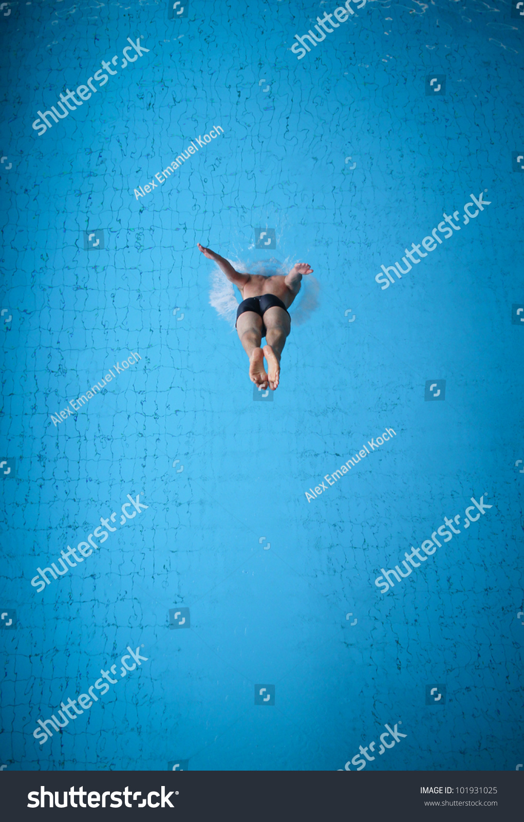 man jumping in pool