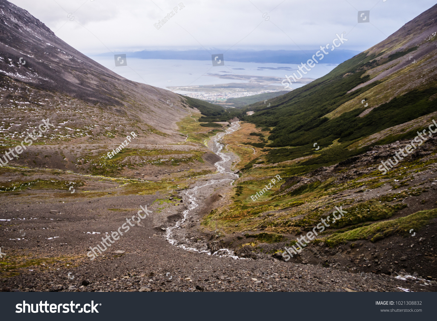 Valley of the Martial glacier and his river with Ushuaia and the Beagle channel in the back