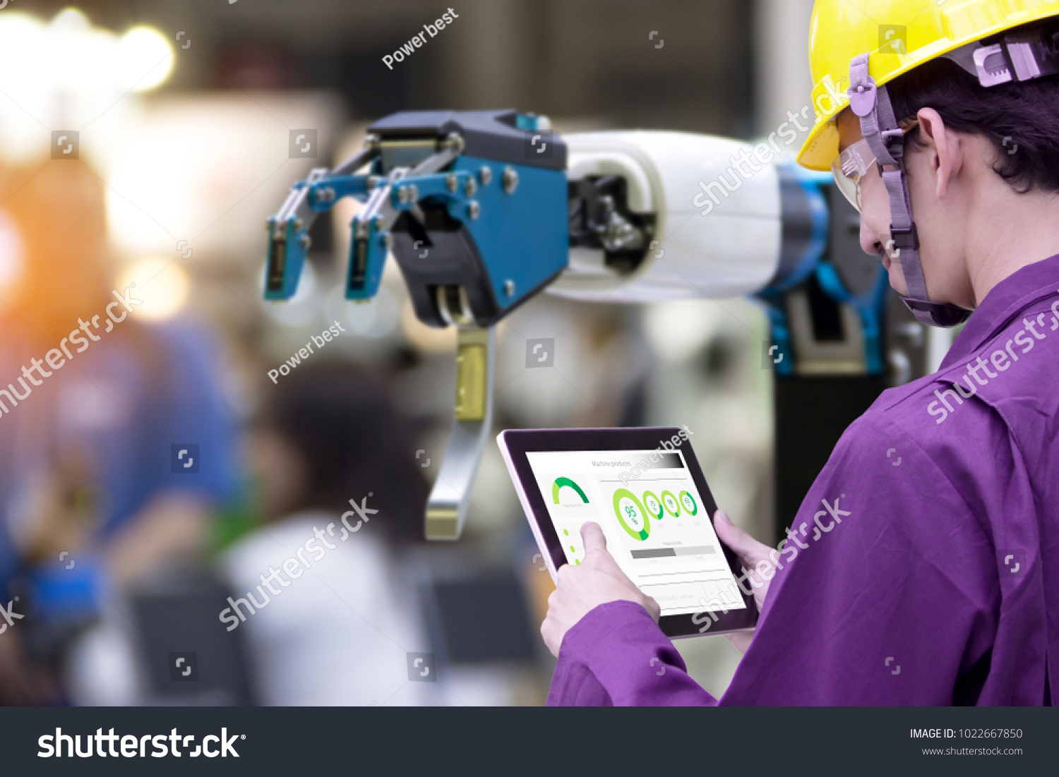 Industry 4.0 Robot concept .Engineers use laptop computers for machine maintenance  automation tools  robot arm at the factory.

