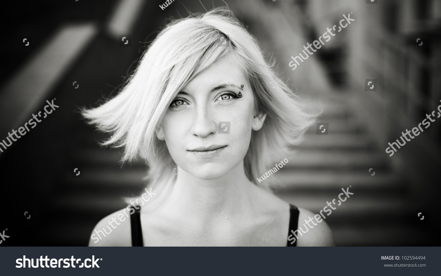 black and white portrait with lite wind and soft natural light selective focus on eyes