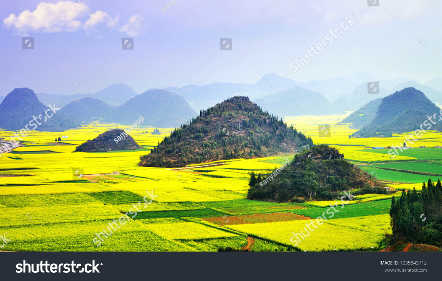 Karst landscape and rape flowers - in China's yunnan province