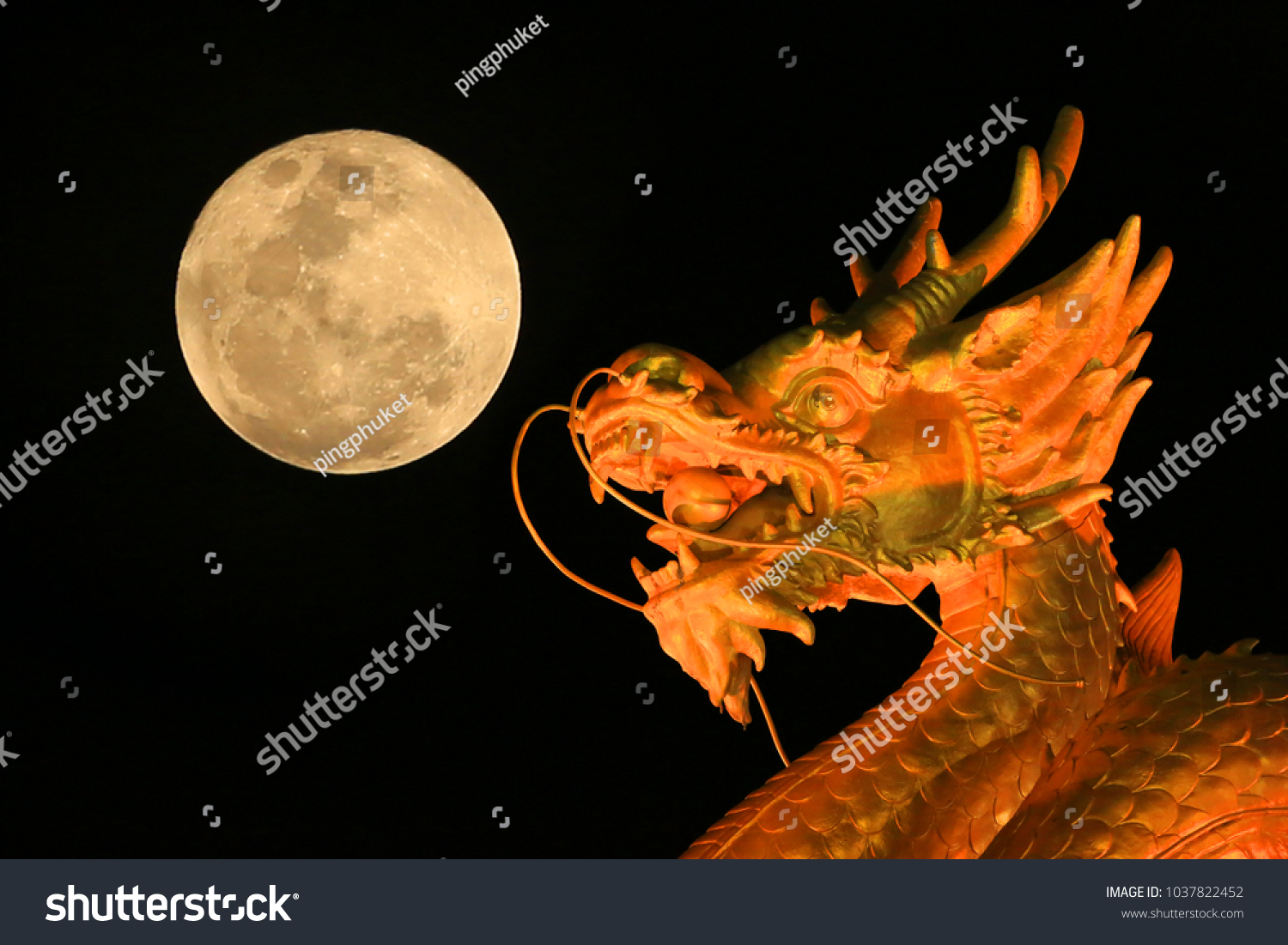 Golden dragon with moon in sky background.