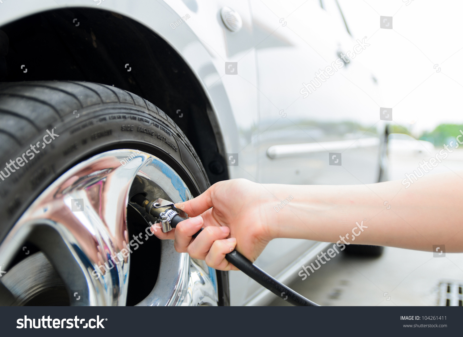 Checking tire pressure. Pumping air into auto wheel. Vehicle safe concept.