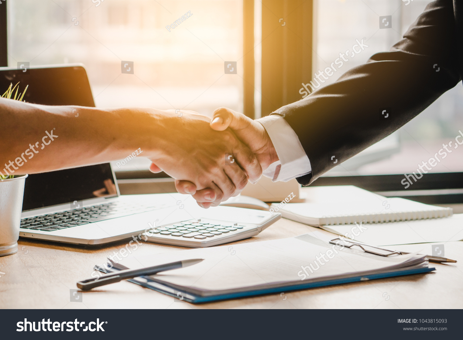 Partners corporate relationship concept. Close up handshake of business people in meeting attendance.