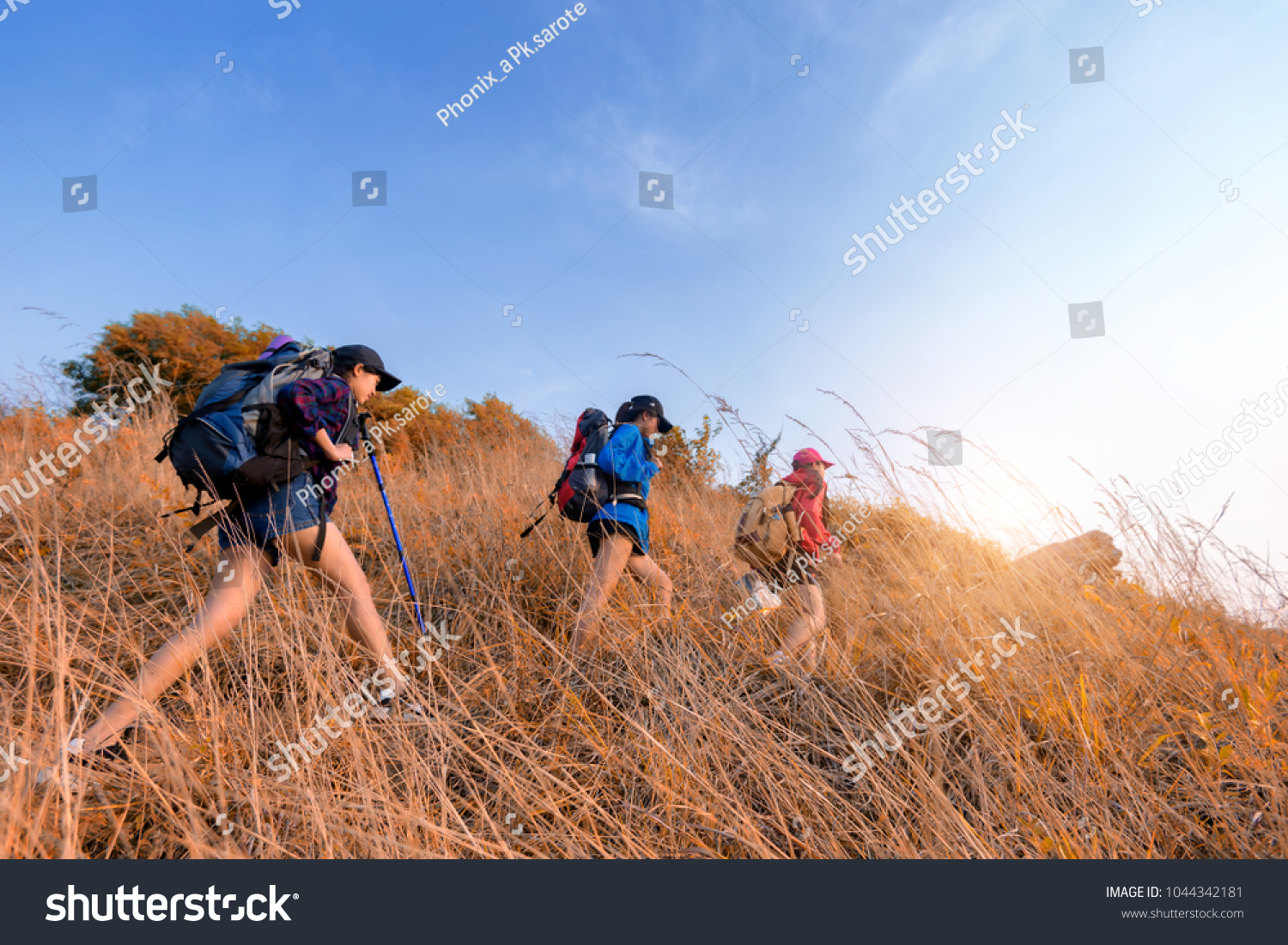 Group of young Asian woman travel hipster hiking on mountain holiday wild adventure. Background for Travel concept .