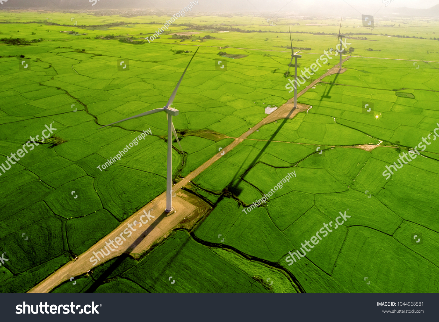 Landscape with Turbine Green Energy Electricity  Windmill for electric power production  Wind turbines generating electricity on rice field at Phan Rang  Ninh Thuan  Vietnam. Clean energy concept.