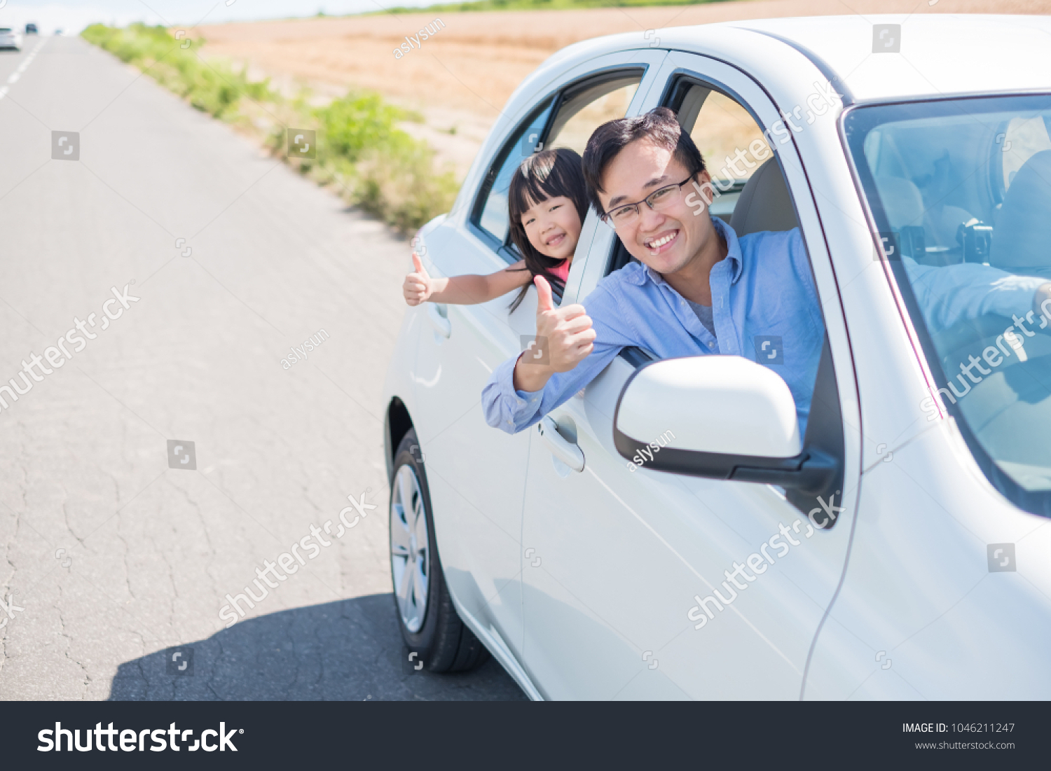 man with daughter drive car in Furano