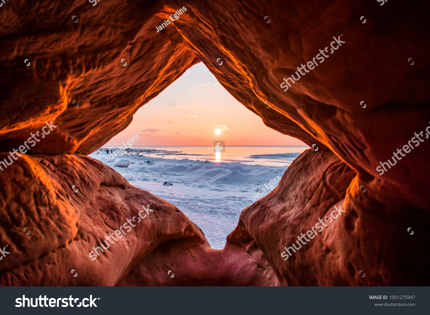 Colorful sunset over the Baltic sea through Veczemju cliffs during winter