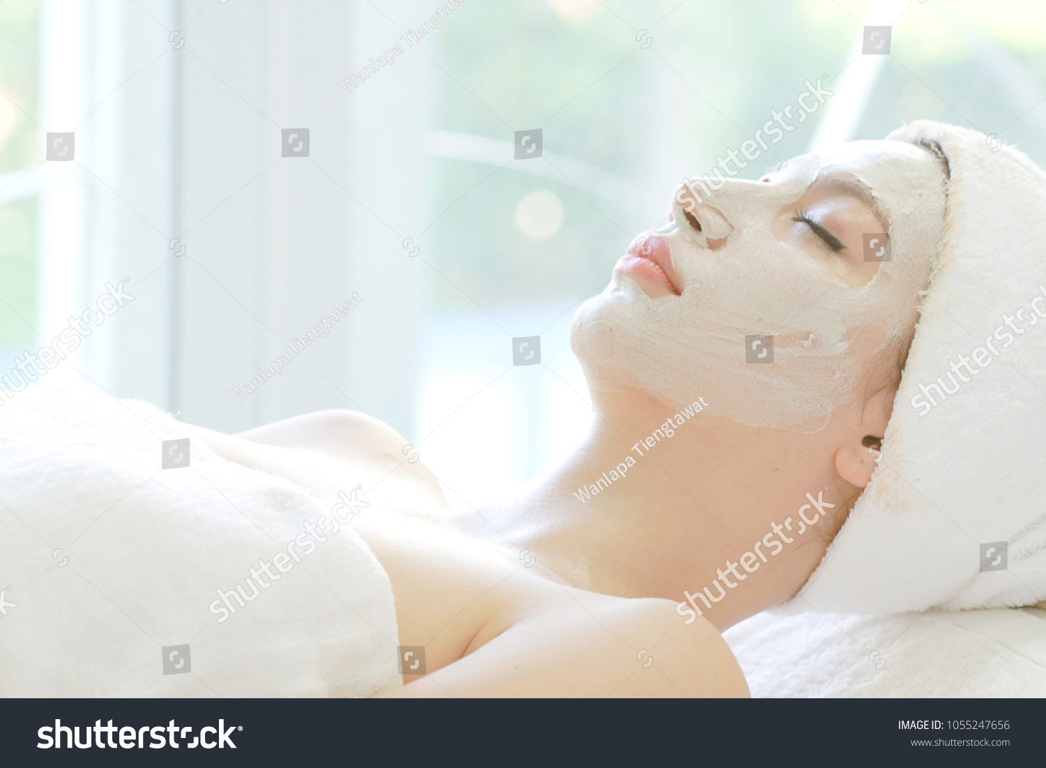 mask face spa cheerful beautiful lady relax healthy therapy to renew close-up skin care with mud in room spa content to facial treatment daily