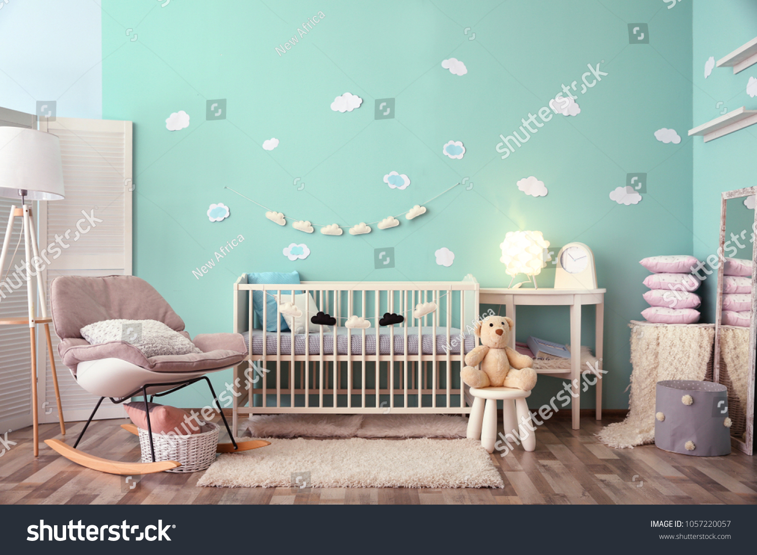 Modern baby room interior with crib and rocking chair