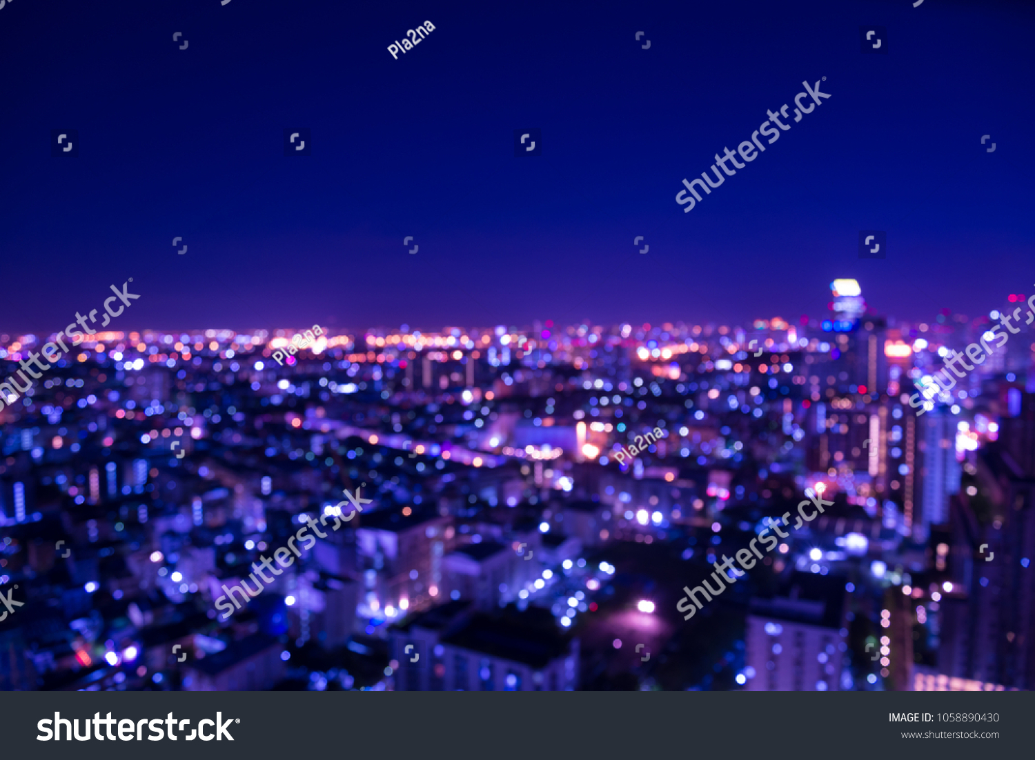 Abstract urban city night light bokeh defocused background with sky space area