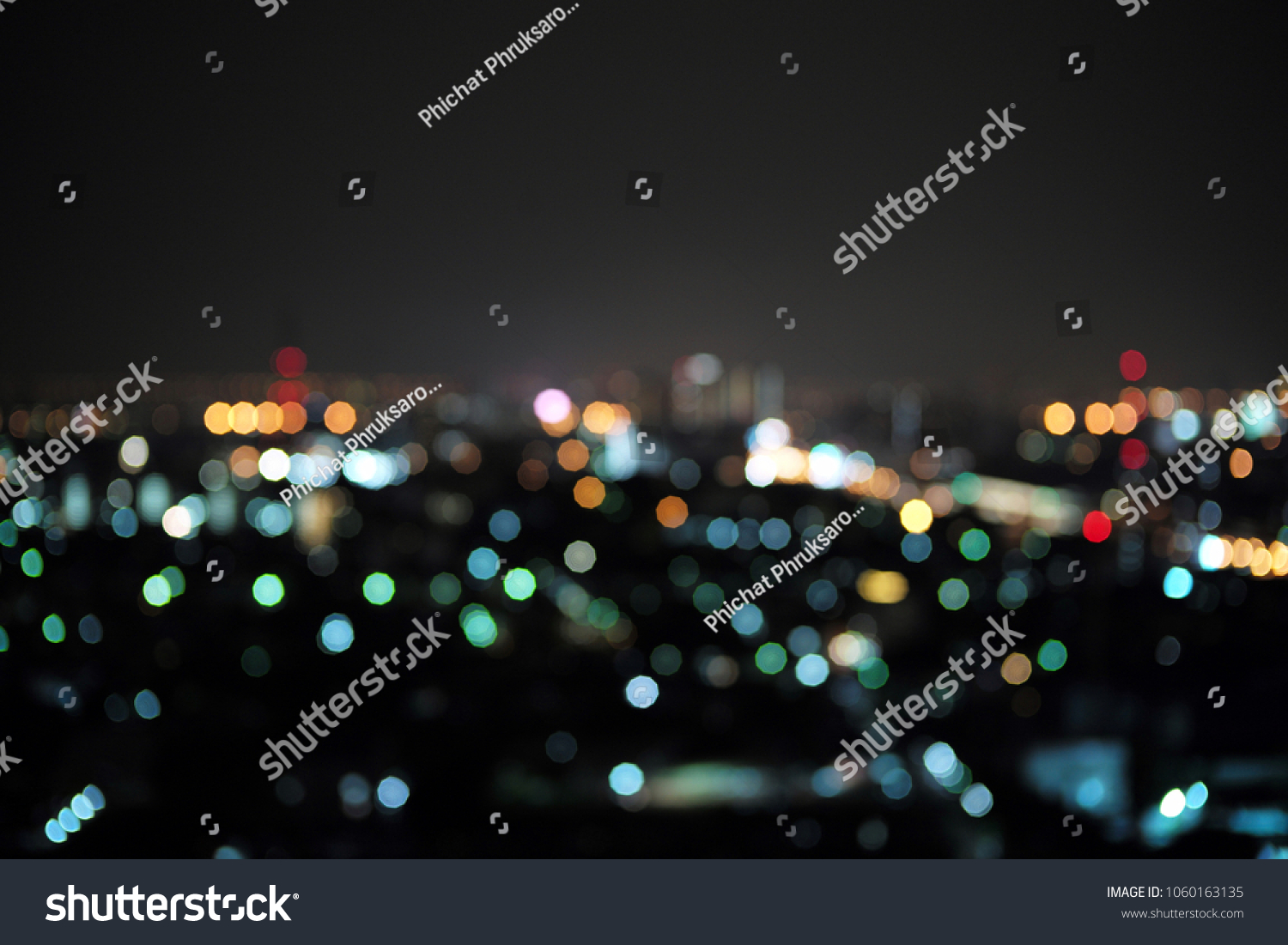 Abstract bluured bokeh of the city light. Defocused picture of cityscape at night
