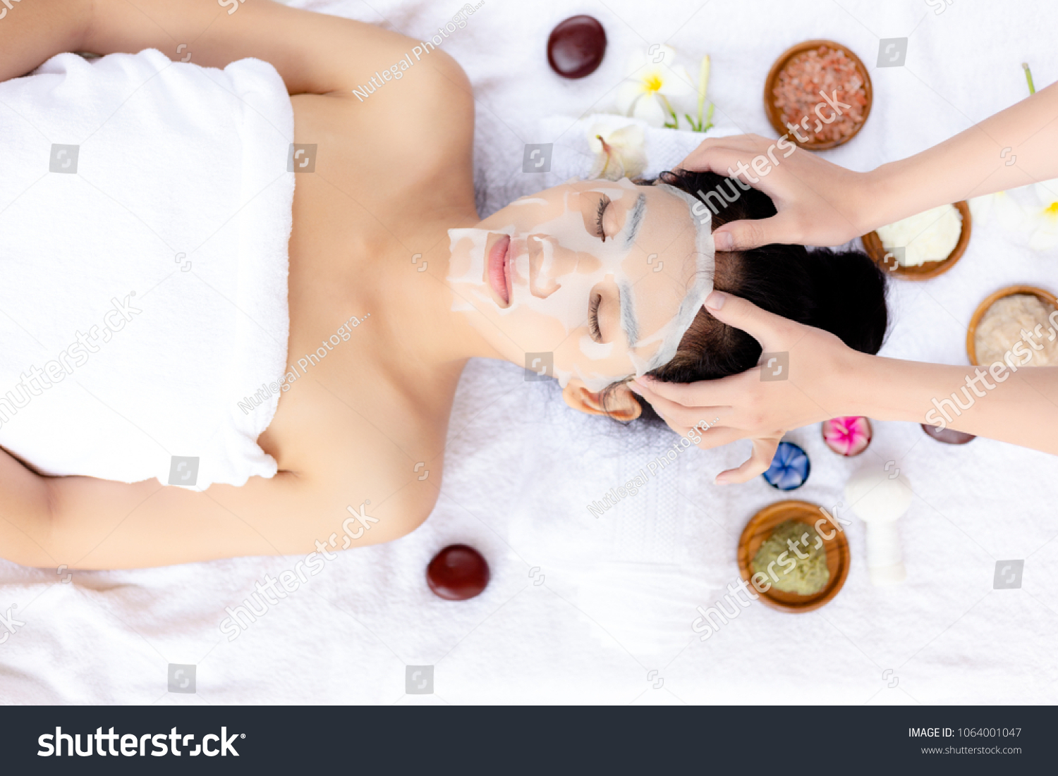 Massager massage on her head make beautiful woman relieve stress from work and makes her feel relaxed. Attractive beautiful lady love massage aromatherapy at spa shop. It has nice smell from herbs