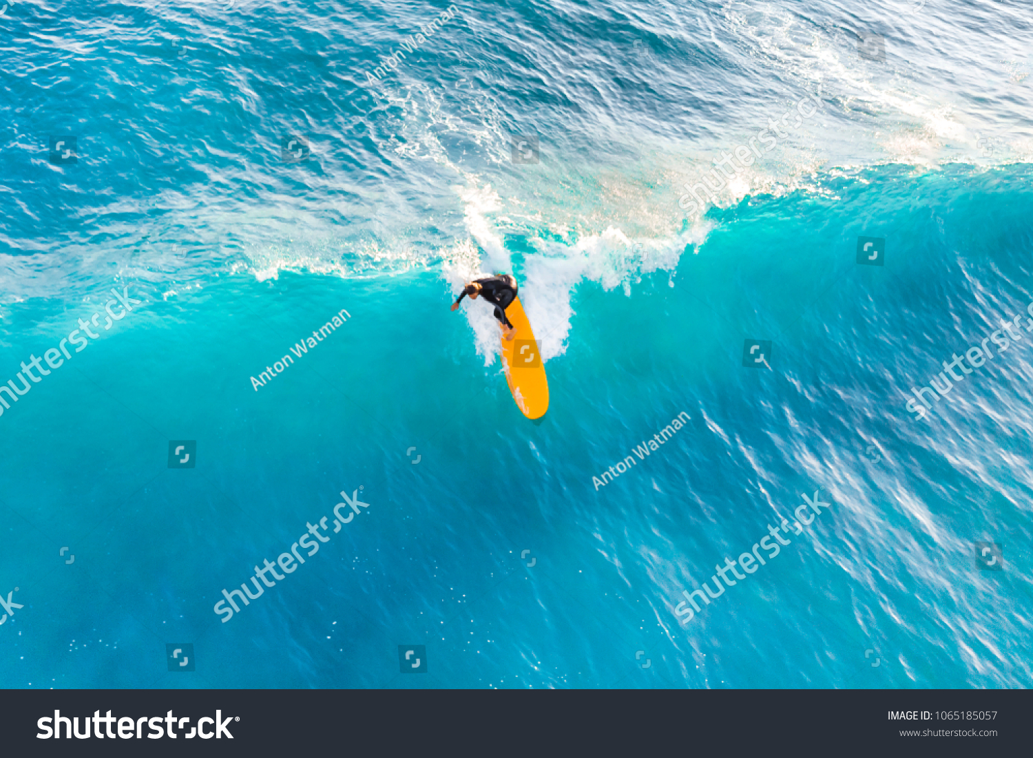 Surfer ride on the waves in the ocean  top view