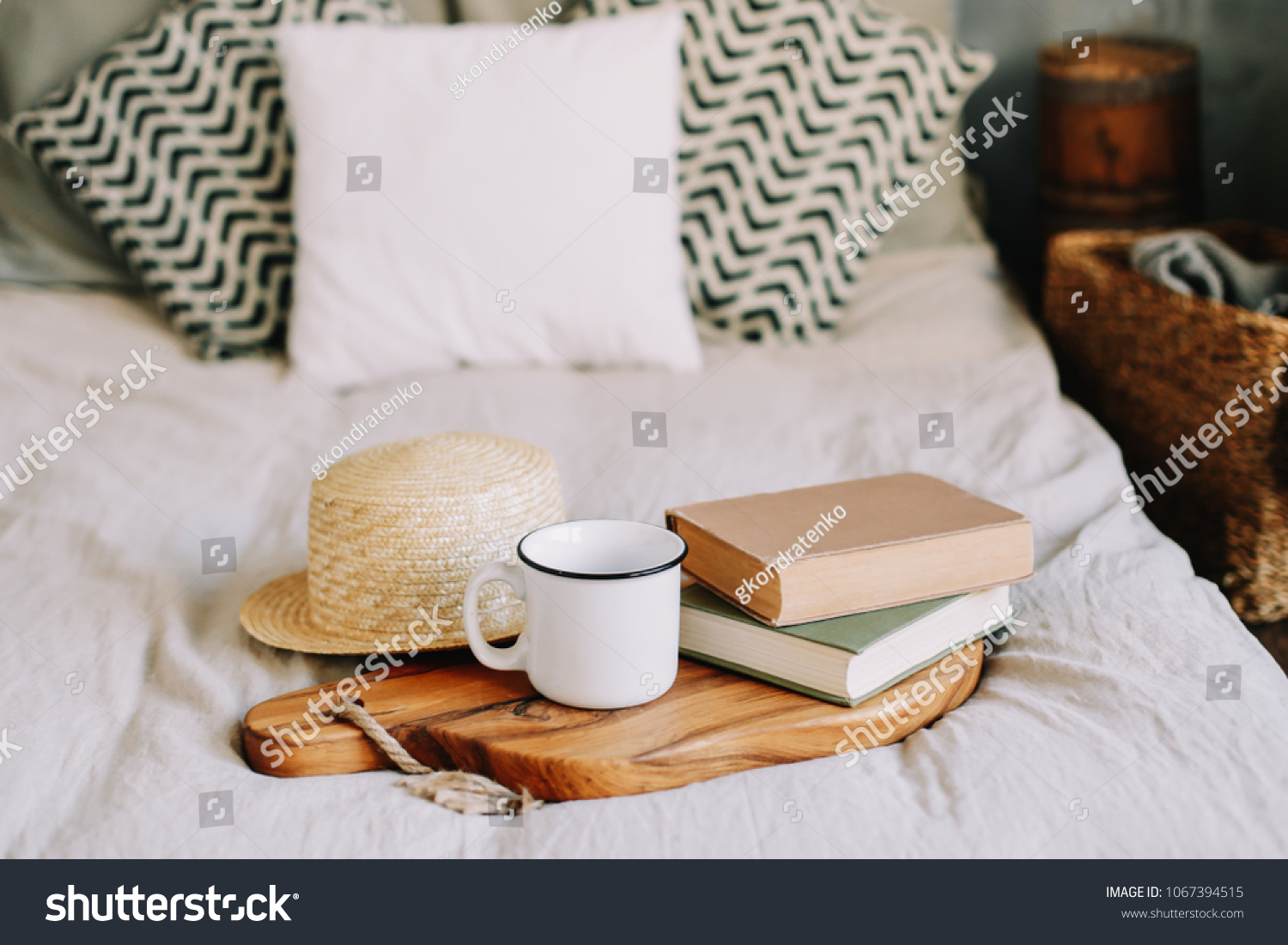 Books straw hat and coffee cup. Breakfast in bed. Sweet home. Good morning. Atmospheric hygge style. flat lay still life