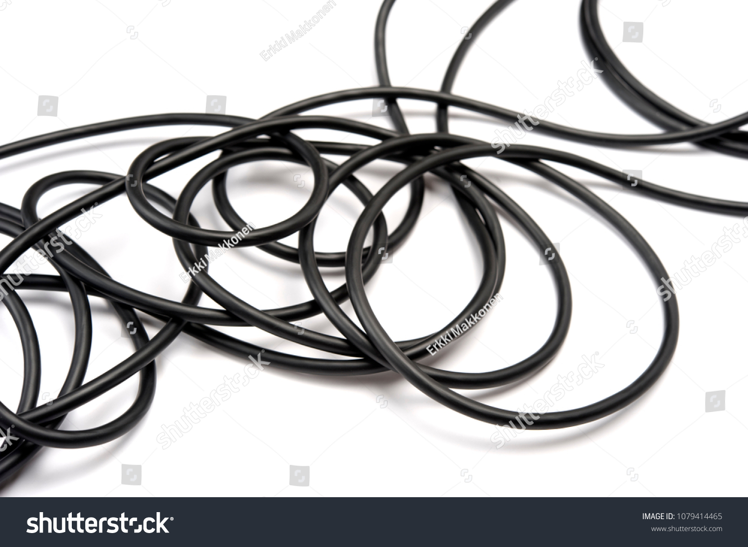 black electric cable on white background. focus on foreground