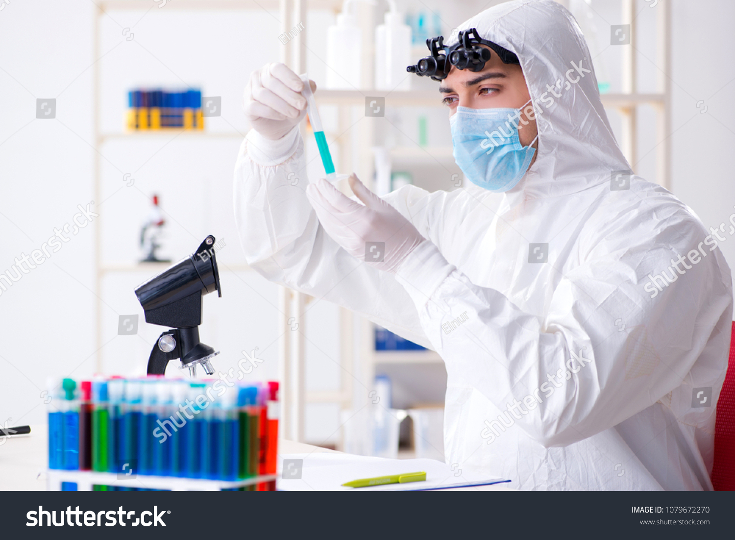 Young chemical scientist working in lab