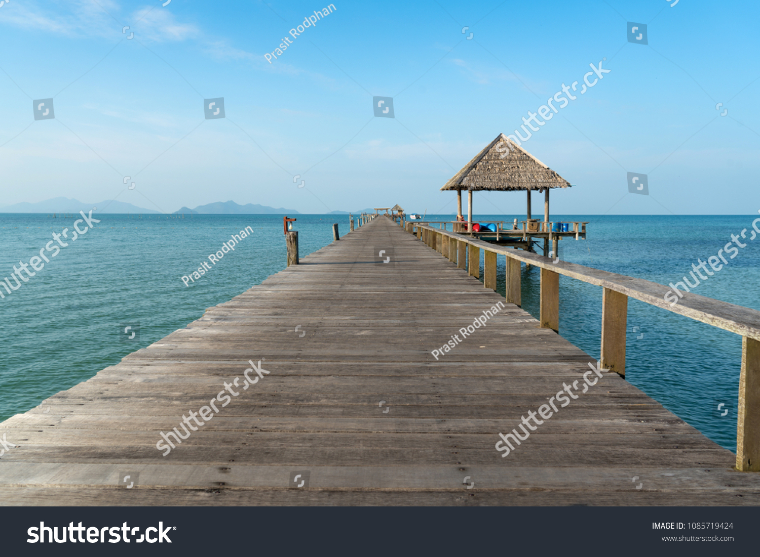 wooden pier between sunset in phuket thailand.