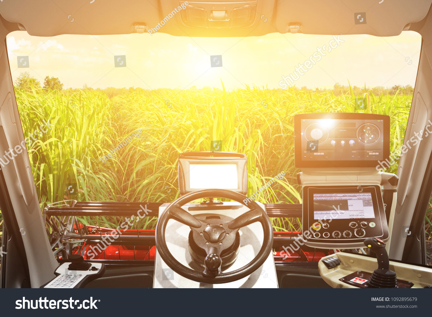 Interior cabin of smart agricultural tractor a combine and harvesting in sunrise. 