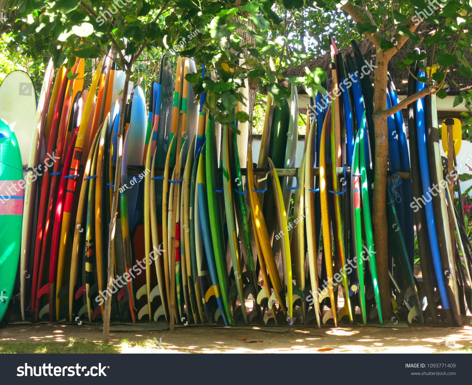 Big set of different surfing boards on stand  surfboard renting place or surfschool
