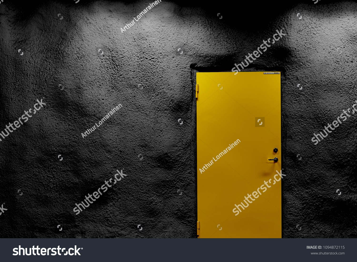                          Yellow door with black wall with shadows and light. Copy space.      