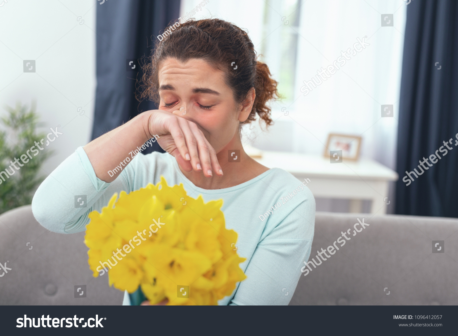 Resisting a scent. Sicklooking young lady suffering from