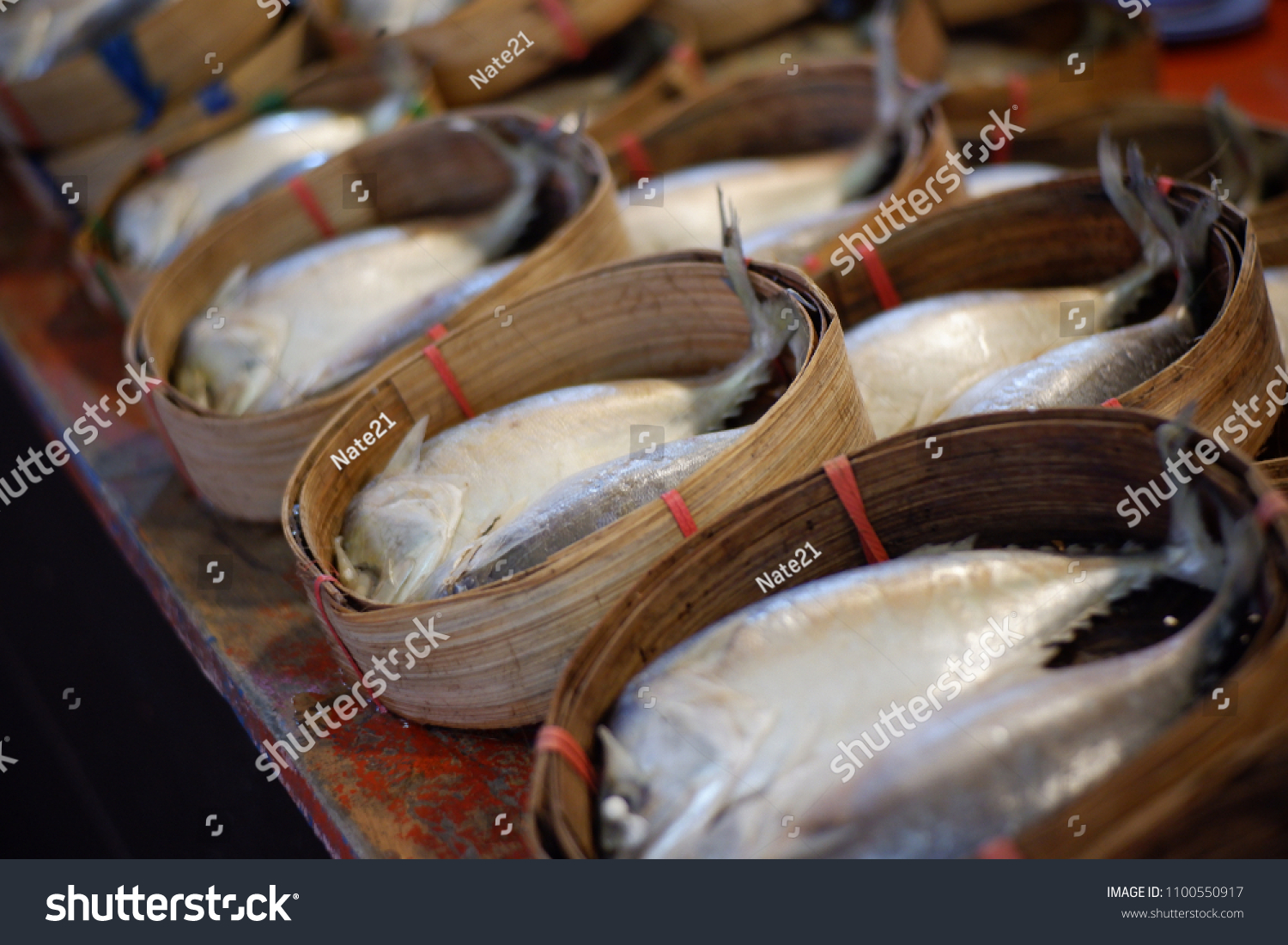 fresh mackerels on Thai style bamboo basket for sell in market.