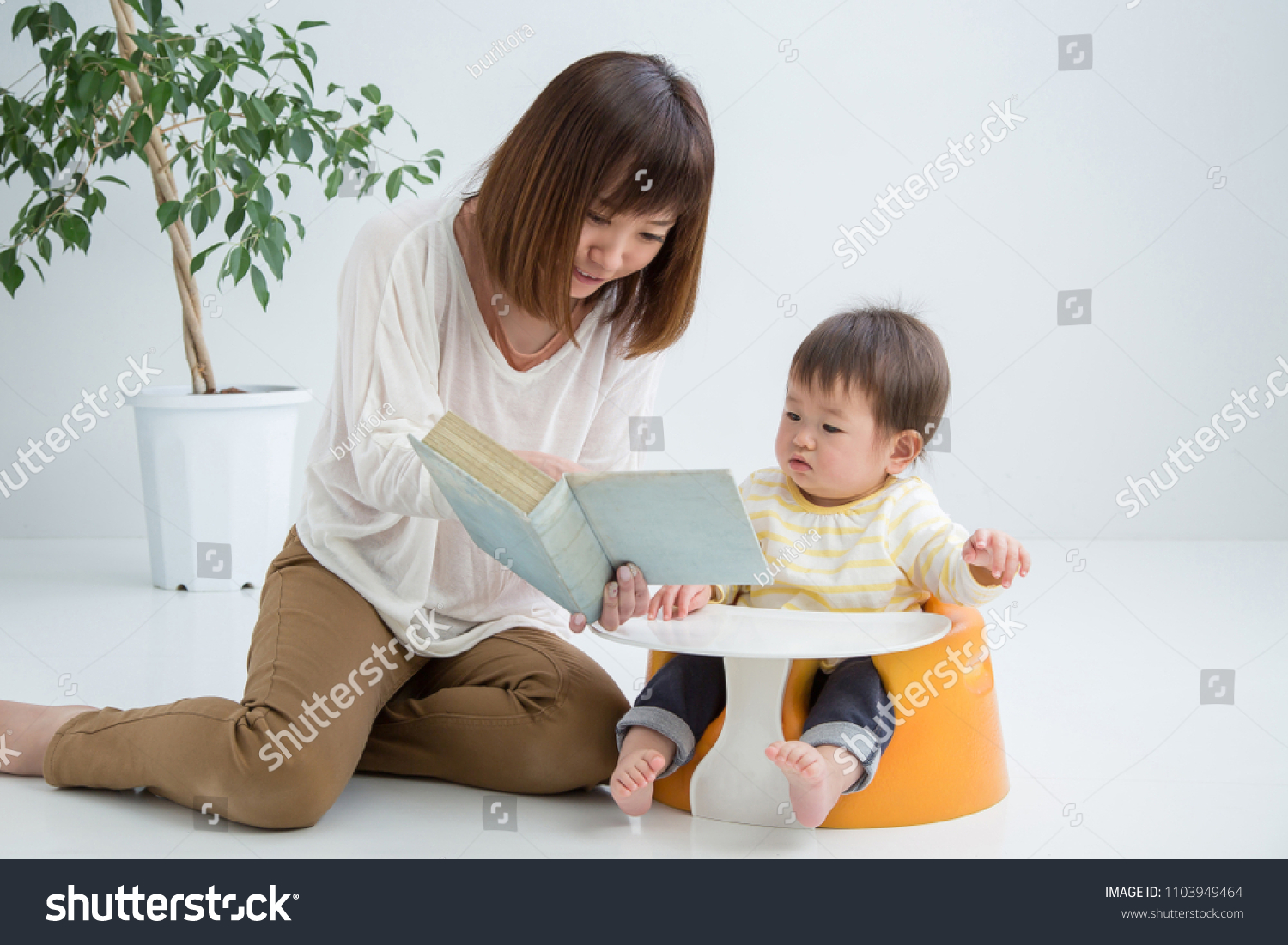 The baby who plays in a room and mother